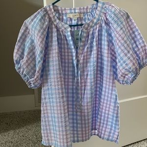 New with tags! Lavender, baby blue, and white seersucker top with puff sleeves.